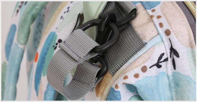 Backpack diaper bag with stroller hook