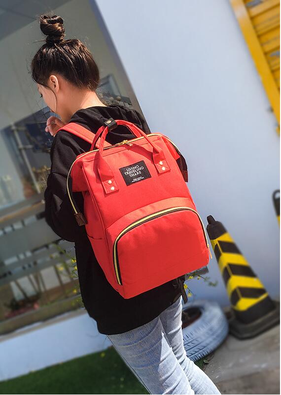 model show of red mummy backpack