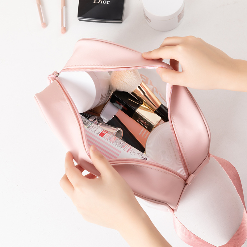 opening of pink PVC women cosmetic wash bag