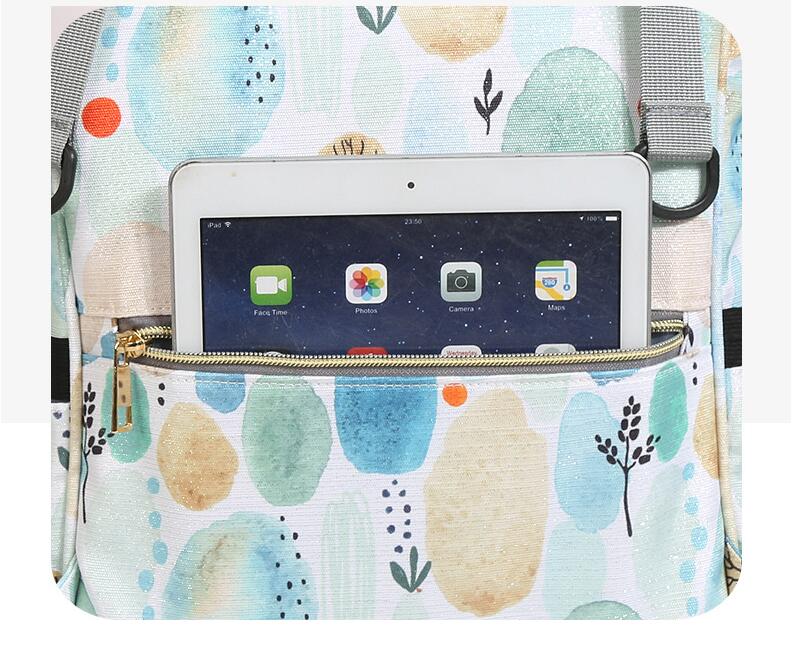Backpack diaper bag with back pocket