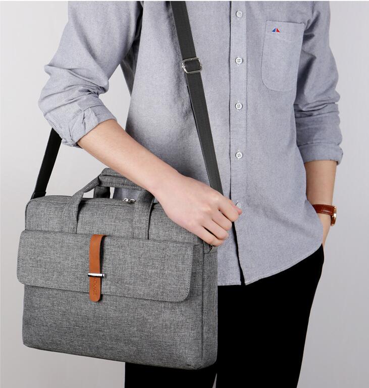 model show of grey computer shoulder bag