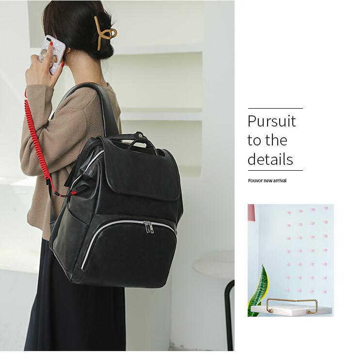 model show-black Mommy bag backpack